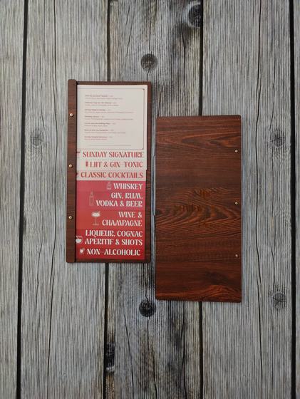 Tall dark wood MDF menu board with red printed bar menu insert beside its plain wood back cover, custom made by RestroCart, New Delhi