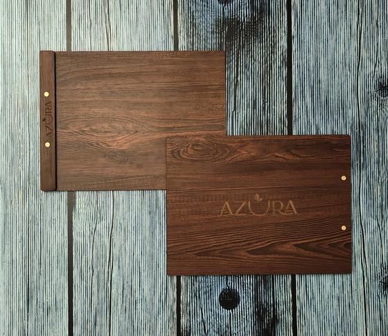 Two landscape wood grain MDF menu boards with brass screws and engraved spine and cover logo, custom made by RestroCart, New Delhi