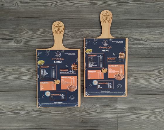Two MDF paddle menu boards with engraved cup logo and dark blue printed menu cards, custom made by RestroCart, New Delhi