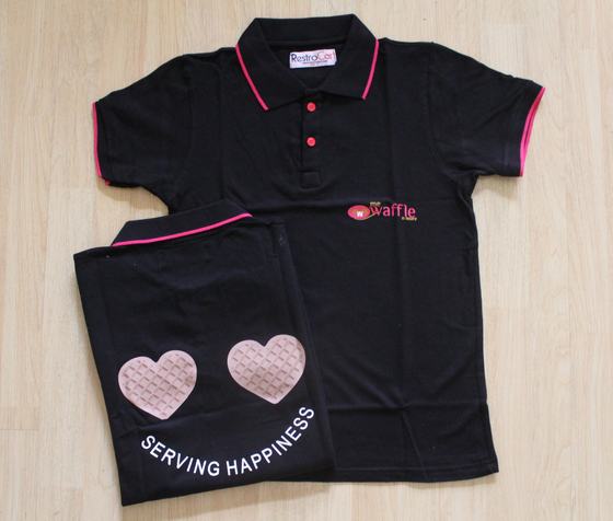 Black polo t-shirts with pink tipping, chest logo and waffle hearts back print, custom made for Me Waffle N More by RestroCart, New Delhi