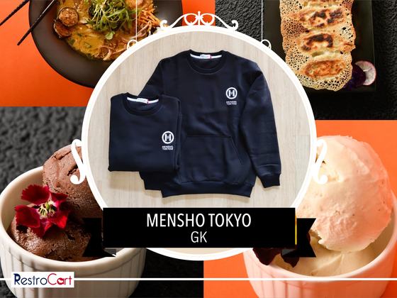 Two navy crew-neck sweatshirts with small white printed logo on the chest, one folded, custom made for Mensho Tokyo by RestroCart, New Delhi