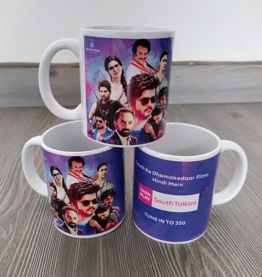 Stack of three white ceramic mugs with full-wrap colourful movie poster print, custom made by RestroCart, New Delhi