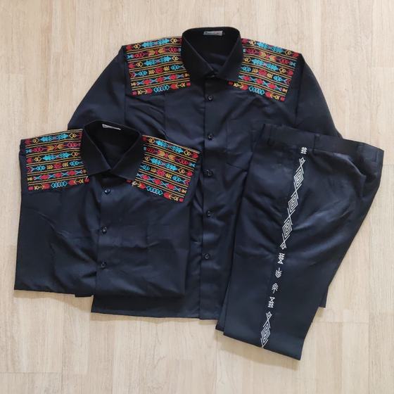 Black shirts with tribal embroidery on shoulders and black trousers with side embroidery, custom made for Miss Margarita by RestroCart, New Delhi