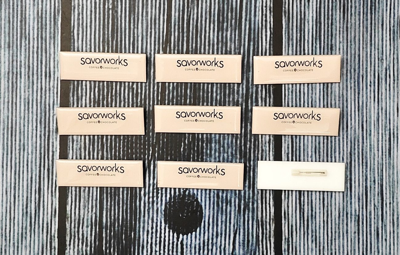 Custom acrylic and metal staff name badges for restaurants, made by RestroCart