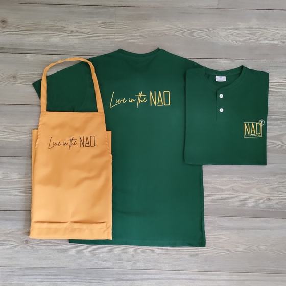 Green T-shirt and henley with gold printed script, mustard bib apron with matching print, custom made for NAO by RestroCart, New Delhi