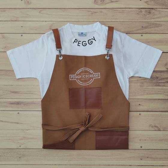 White T-shirt with collar print and brown canvas bib apron with leatherette pockets, custom made for Peggy Ice Creams by RestroCart, New Delhi