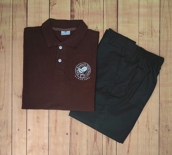 Dark brown polo t-shirt with white circular chest logo, folded with charcoal service trousers, custom made by RestroCart, New Delhi