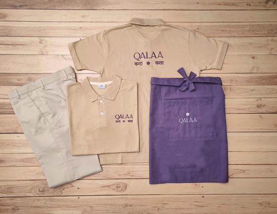 Beige polo t-shirts with purple logo, beige trousers and purple waist apron with matching print, custom made by RestroCart, New Delhi