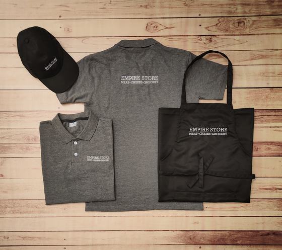 Grey melange polo t-shirts with white print, black cap and black bib apron with white lettering, custom made by RestroCart, New Delhi