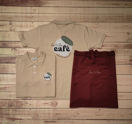 Beige polo t-shirts with large round back print and maroon waist apron with gold embroidery, custom made by RestroCart, New Delhi