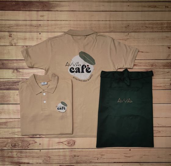 Beige polo t-shirts with large round back print and bottle green waist apron with gold logo, custom made by RestroCart, New Delhi