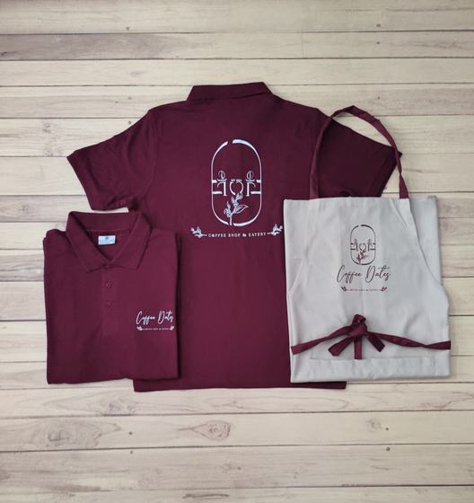 Maroon polo t-shirts with white line art logo on the back and a beige bib apron with maroon ties, custom made by RestroCart, New Delhi