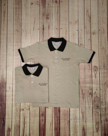 Beige polo t-shirts with black collar and sleeve tipping and black embroidered chest logo, custom made by RestroCart, New Delhi