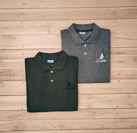 Folded olive and grey marl polo t-shirts with small printed sailboat logo at the lower front, custom made by RestroCart, New Delhi