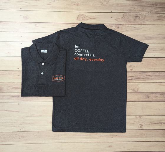 Charcoal marl polo t-shirts with white and orange printed coffee slogan on the back, two views, custom made by RestroCart, New Delhi