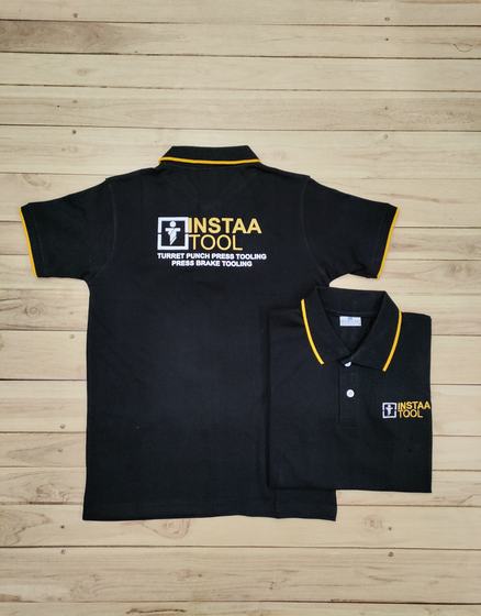Black polo t-shirts with yellow collar and sleeve tipping and white and yellow printed text logo, custom made by RestroCart, New Delhi