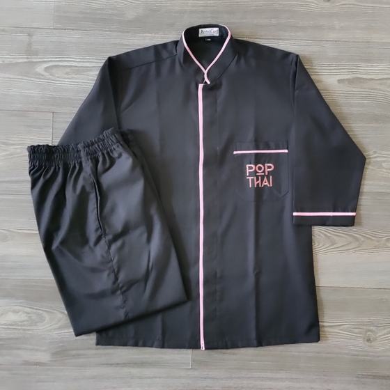 Black long sleeve tunic with pink piping and pink embroidered pocket logo, with black trousers, custom made for Pop Thai by RestroCart, New Delhi
