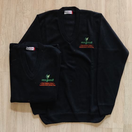 Two black V-neck knit sweaters with green and orange embroidered logo on chest, laid flat, custom made by RestroCart, New Delhi