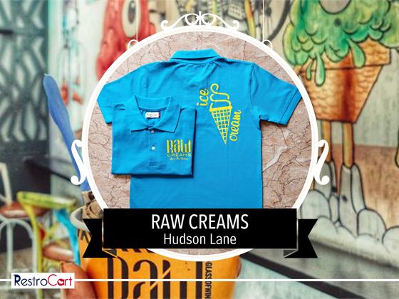 Two turquoise polo t-shirts with yellow ice cream cone print and small chest logo, custom made for Raw Cream by RestroCart, New Delhi