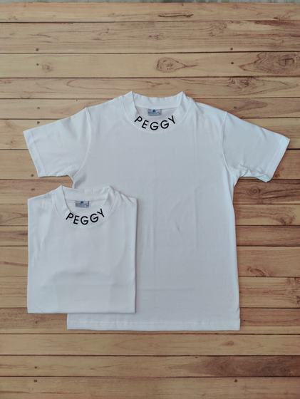 White round-neck t-shirts with black printed name on the high neckline, one folded, custom made by RestroCart, New Delhi