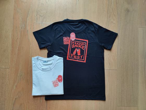Black and white round-neck t-shirts with red stamp style printed festival graphic, custom made by RestroCart, New Delhi