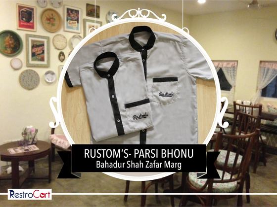 Grey short-sleeve housekeeping shirts with black collar, placket and pocket trim, custom made for Rustoms by RestroCart, New Delhi