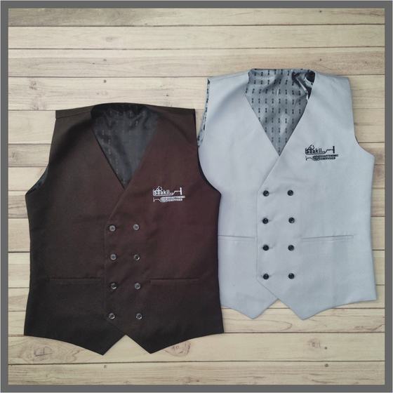 Brown and light grey double breasted waistcoats with patterned lining and embroidered logo, laid flat, custom made for Saaki by RestroCart, New Delhi