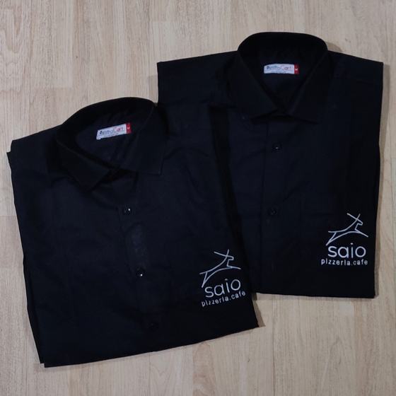 Two black full sleeve shirts with white embroidered deer logo on lower front, folded, custom made for Saio Pizzeria by RestroCart, New Delhi