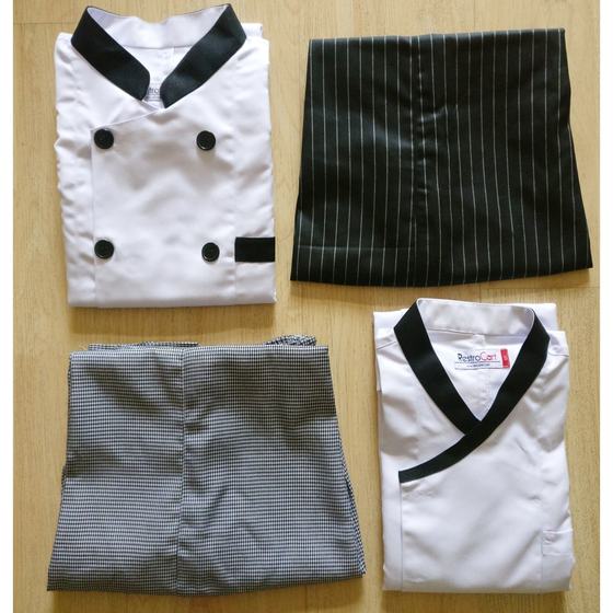 White chef coats with black collar and buttons, houndstooth trousers and pinstripe apron, laid flat, custom made for Soho by RestroCart, New Delhi