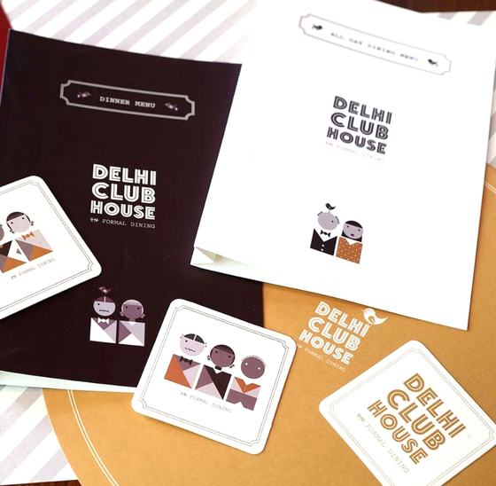 Printed dinner menus and square coasters with quirky illustrated characters, black and kraft, custom made by RestroCart, New Delhi