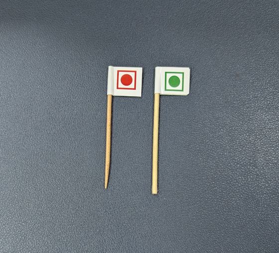 Two toothpick food flags printed with red and green veg and non-veg symbols, custom made by RestroCart, New Delhi