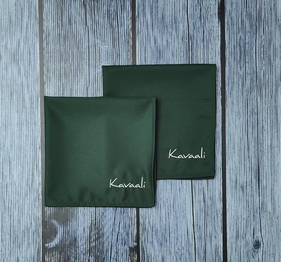 Bottle green cloth table napkins with white embroidered script name in the corner, custom made by RestroCart, New Delhi