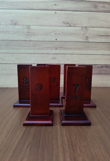 Set of mahogany wood table number stands with engraved numbers and logo on square bases, custom made by RestroCart, New Delhi