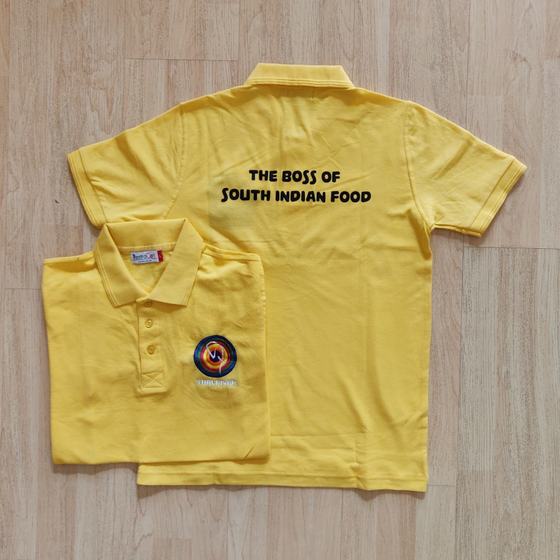 Two yellow polo T-shirts with black slogan print on back and round logo on chest, custom made for Thalaivar by RestroCart, New Delhi