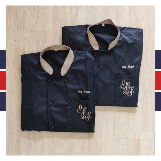 Navy double-breasted chef coats with beige collar and gold embroidered logo and chef names, custom made for The Coffee Shop by RestroCart, New Delhi