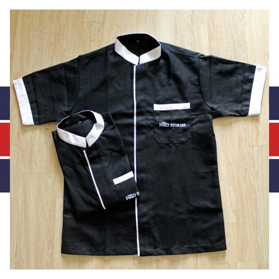 Two black half sleeve housekeeping tunics with white collar, placket and cuff trim, custom made for The Food Stories by RestroCart, New Delhi