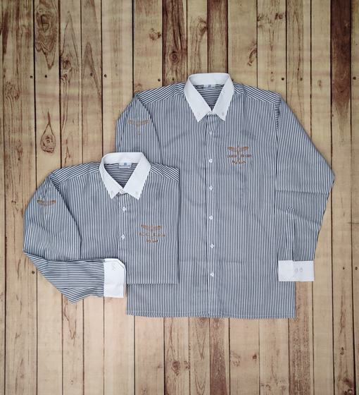 Two grey and white striped uniform shirts in different sizes with white contrast collars and cuffs and an embroidered logo