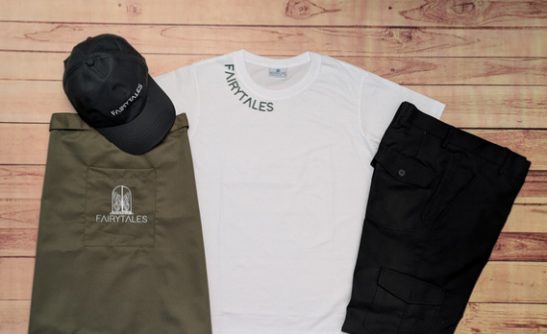 Uniform t-shirts and caps flatlay in olive, white and black