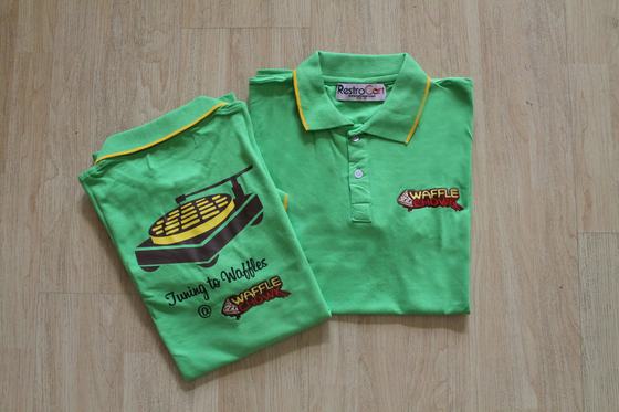 Parrot green polo t-shirts with yellow tipped collar and waffle graphic back print, custom made for Waffle Chowk by RestroCart, New Delhi