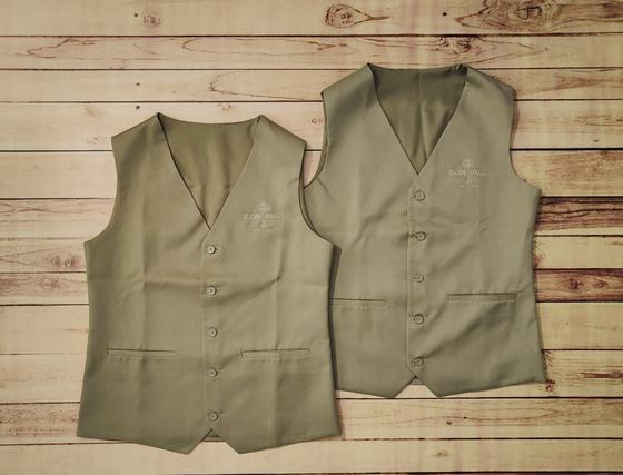 Pair of khaki V-neck waistcoats with tone-on-tone embroidered logo and welt pockets, laid flat, custom made by RestroCart, New Delhi
