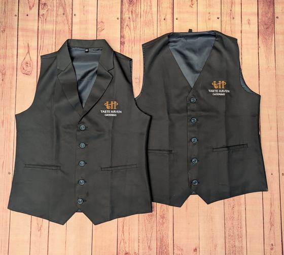 Black notch lapel waistcoats with gold embroidered logo and grey lining, front and back, custom made by RestroCart, New Delhi