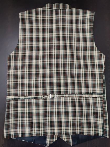 Back view of a brown and cream checked waistcoat with adjustable half belt and buckle, custom made by RestroCart, New Delhi