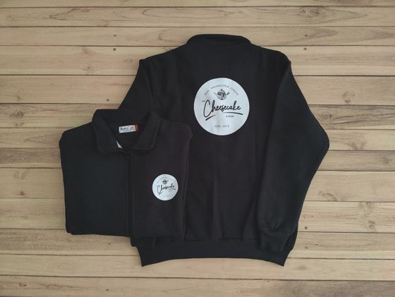 Black collared zip sweatshirts with large round white printed logo on back and small chest badge, custom made by RestroCart, New Delhi