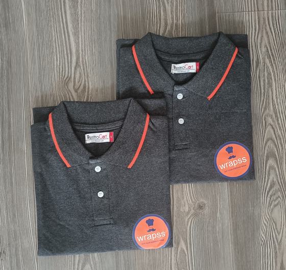 Charcoal polo t-shirts with orange tipped collar and round orange chest logo, custom made for Wrapps by RestroCart, New Delhi