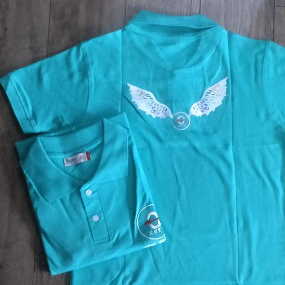 Teal polo T-shirts with white printed wings logo on back and sleeve logo, one folded, custom made for Xero Degrees by RestroCart, New Delhi
