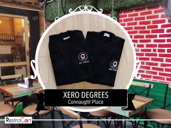 Two black V-neck sweaters with white and red embroidered logo, laid flat, custom made for Xero Degrees by RestroCart, New Delhi
